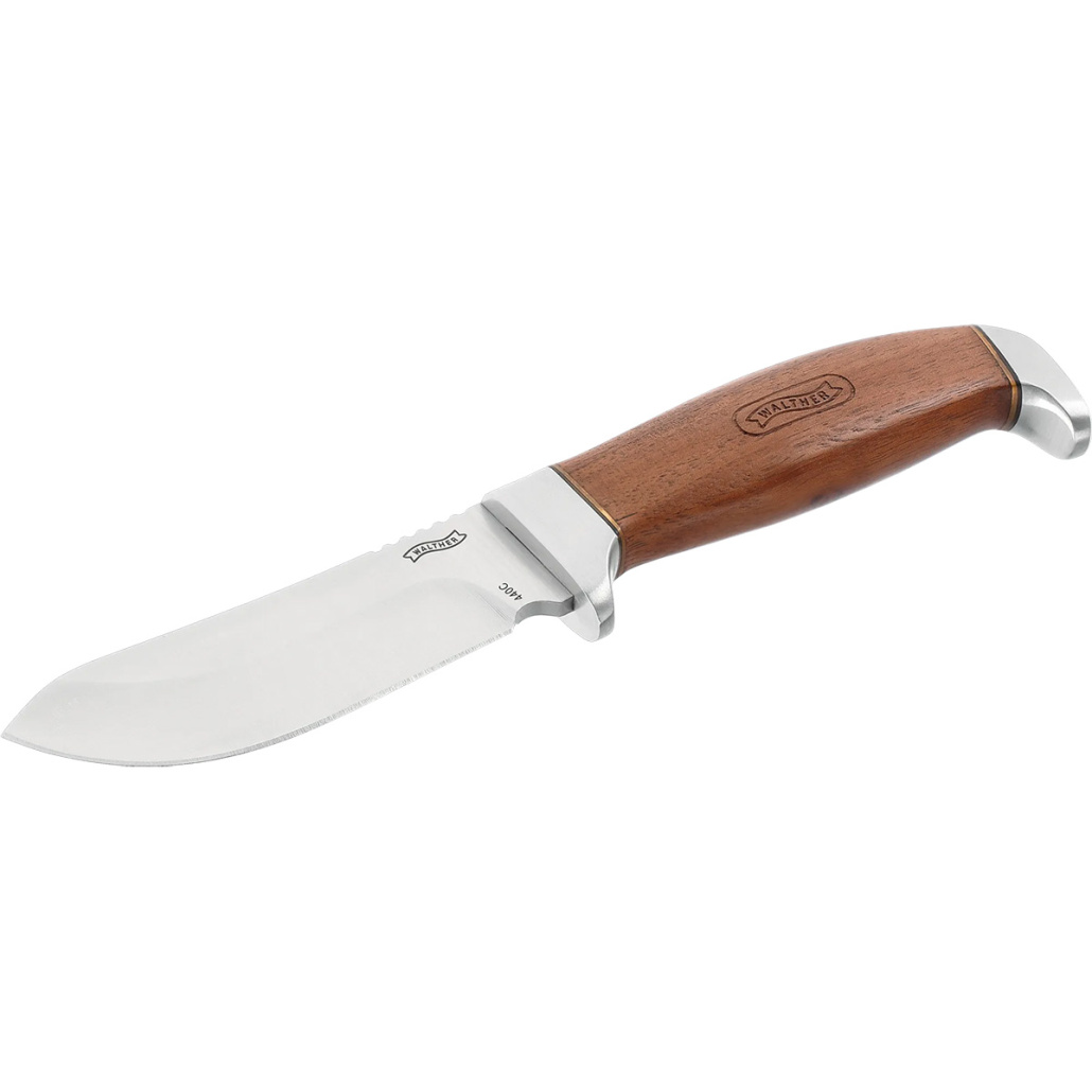 Walther Premium Skinner är en elegant kniv med valnötsgrepp och en rejäl handguard.440C har den högsta hårdheten av allt rostfritt och värmebeständigt stål.